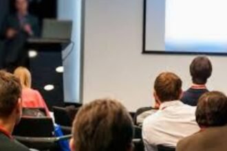 group of speakers at a conference