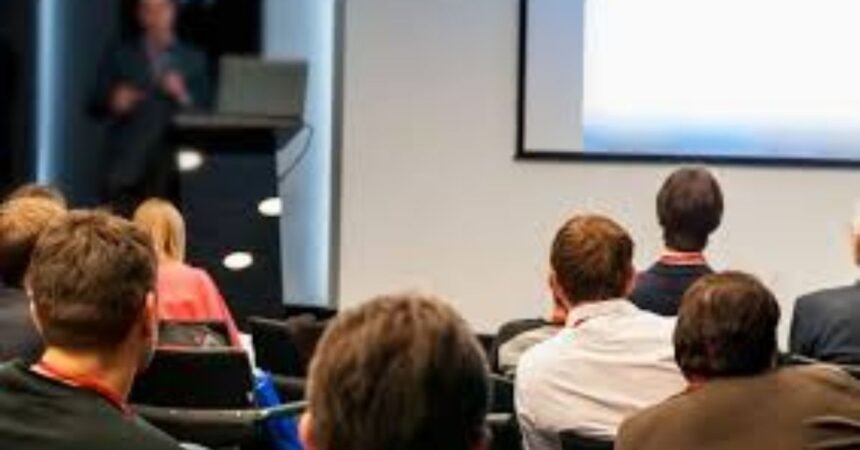 group of speakers at a conference